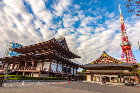 Main hall (Hondo) of Zojo-ji temple and Tokyo tower in Minato district, Tokyo, Japanの写真素材