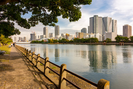 Hamarikyu gardens embankment with skyscrapers at background, Tokyo, Japan