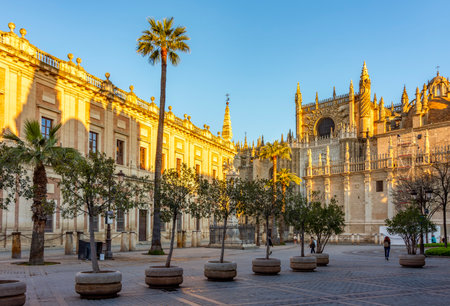 Seville cathedral and Archive of Indies (Archivo General de Indias) on Triumph square, Spainの写真素材