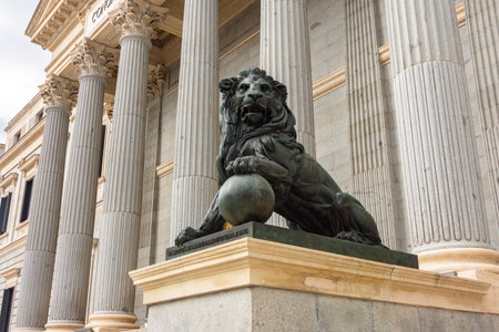 Statue of lion at Palace of Parliament (Congress of Deputies) in Madrid, Spainの写真素材