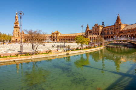 Seville, Spain - 28 March 2025: Architecture and canals of Spain square in Maria Luisa parkの写真素材