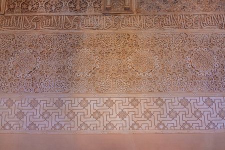 Granada, Spain - 30 March 2025: Decoration on walls of Nasrid palace in Alhambraの写真素材