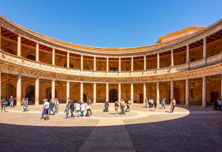 Granada, Spain - 30 March 2025: Round courtyard of Palace of Charles V in Alhambra complexの写真素材