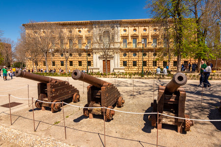Granada, Spain - 30 March 2025: Old cannons at palace of Charles V in Alhambra complex