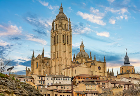 Segovia gothic cathedral over old town at sunset, Spainの写真素材