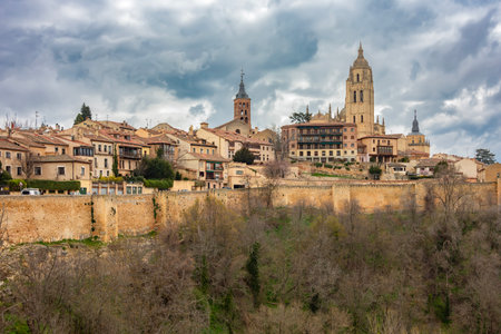 Segovia cityscape with bell tower of Gothic cathedral and town walls, Spainの写真素材