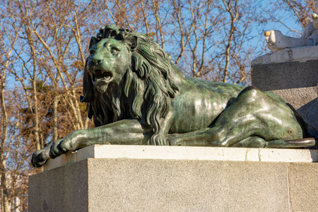 Lion statue at monument to king Felipe IV on Eastern square (Plaza de Oriente), Madrid, Spainの写真素材