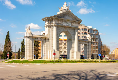 Puerta de San Vicente gates in Madrid, Spain (translation "Charles III wanted to ensure public health and aesthetics by opening a road and building a gate in 1775")の写真素材