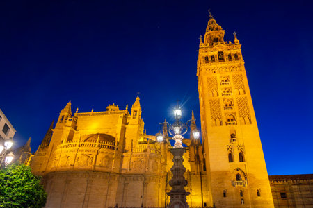 Seville Cathedral with Giralda tower at night, Spainの写真素材