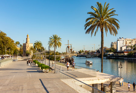 Seville, Spain - 29 March 2025: Tower of Gold (Torre del Oro) on Guadalquivir river embankmentの写真素材
