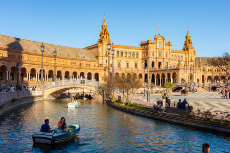 Seville, Spain - 28 March 2025: Architecture and canals of Spain square in Sevilleの写真素材