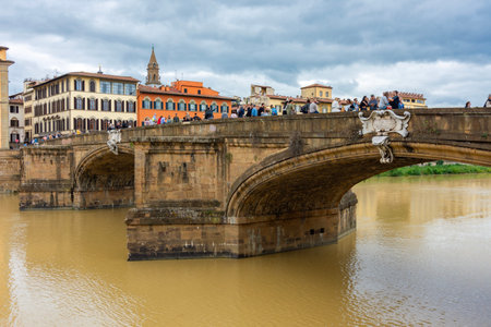 Florence, Italy - 02 October 2025: St. Trinity bridge over Arno riverの写真素材