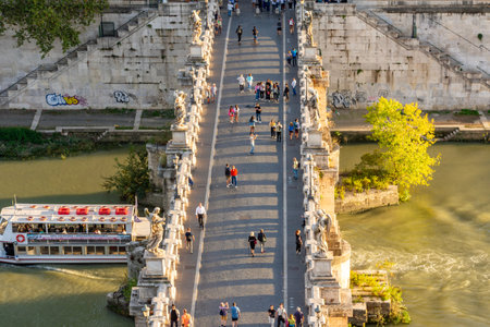 Rome, Italy - 04 October 2025: People walking on St. Angel bridge (Ponte Sant'Angelo) over Tiber...