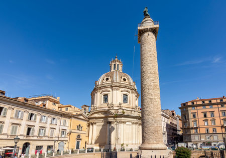 Rome, Italy - 05 October 2025: Trajan's Column and Church of the Most Holy Name of Mary at Trajan...