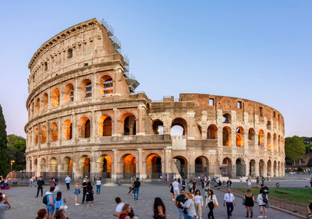 Rome, Italy - 05 October 2025: People walking at ancient Colosseum (Coliseum) building in Rome