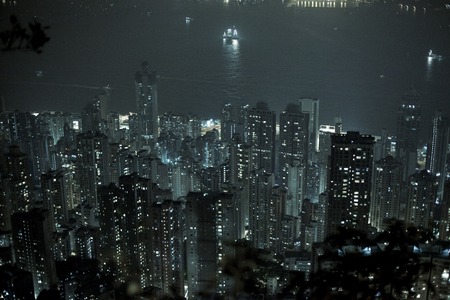 A night view of dense urban infrastructure in Hong Kongの写真素材
