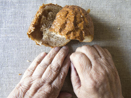 Hands of old woman, selective soft focus.The concept of poverty in retirement.