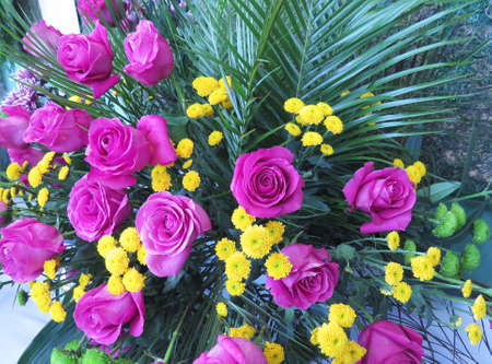 Beautiful art flower gentle bouquet with roses, chrysanthemum, palm leaves Photo for greeting card, cover, flower shop, wedding bouquet, flower market, womens day, mothers day, wedding invitation.の写真素材