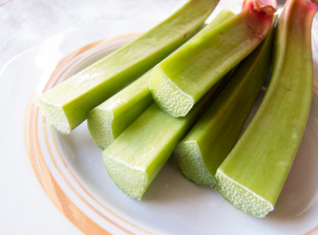 Fresh sliced rhubarb close-up Beautiful organic eco wegan photo food background