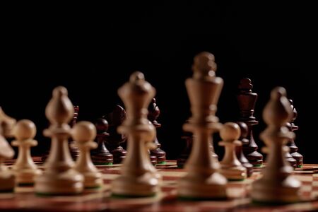 Chess board with large wooden chess pieces. Board game for the development of logic and intelligenceの写真素材