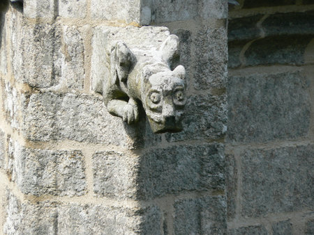 Sculpture on the wall of an old church (chapelle saint barbe), in le FaouÃ«t, Britanny, Franceの写真素材