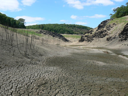Cracked earth in a quarry, natural landscape, closeup of photo. GuerlÃ©dan Lake, dried up, Brittany, Franceの写真素材
