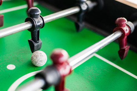 Close up of a foosball game with soccer ball の写真素材