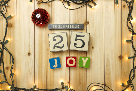 Christmas lights on wooden backgroundの写真素材