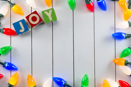 Christmas lights on wooden background