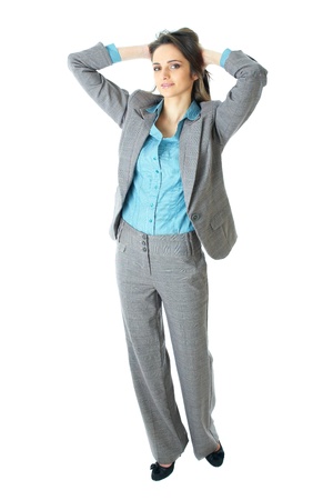 young elegant and attractive businesswoman stretch her hands over her head, relaxed pose, isolated on whiteの写真素材