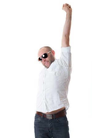 attractive relaxed young guy in sunglasses stretch his arms, isolated on white backgroundの写真素材