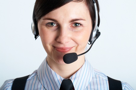female helpdesk opeartor, assistant, portrait on grey background
