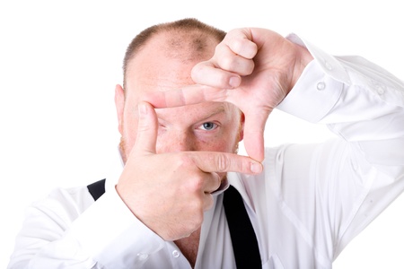 adult photographer trying to make composition, studio shoot isolated on whiteの写真素材