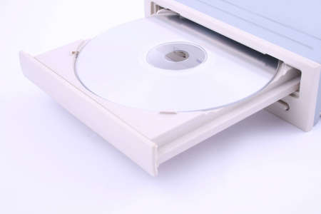 CD/DVD being being inserted into a computer.の写真素材