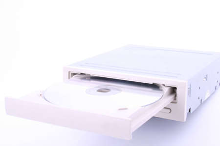 CD/DVD being being inserted into a computer.の写真素材