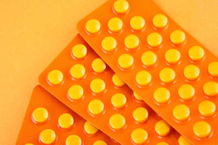 Tablets and vitamin pills in different shapes and colorsの写真素材