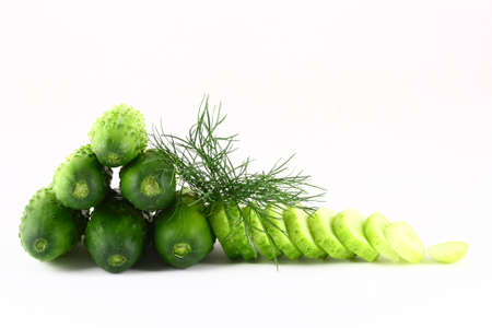 A Cucumber progressively sliced on a white backgroundの写真素材