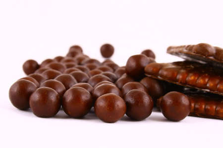 black and brown chocolate sweets against white backgroundの写真素材