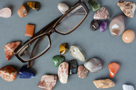 Collection of precious stones on a gray background
