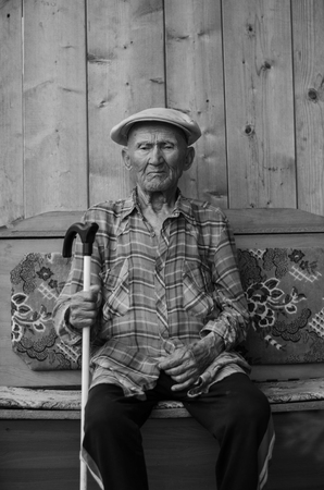 Elder with a cane. Black-and-white photographの写真素材