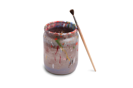 One paintbrush. Dirty water for paint. Isolated on whiteの写真素材
