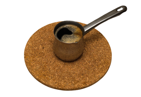 Turkish coffee pot. Stand of cork. Isolated on whiteの写真素材