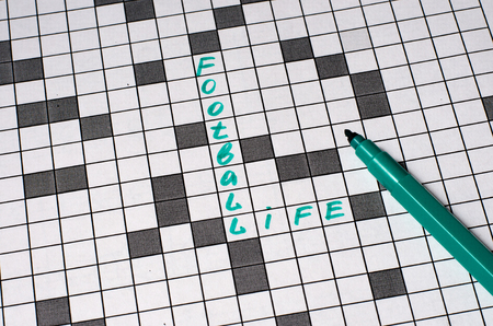 Life football. Text in crossword. Green letters. Close-upの写真素材