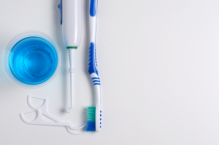 Dental hygiene. Toothbrush, mouthwash, dental floss, oral irrigator. Flat top viewの写真素材