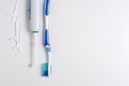 Dental hygiene. Toothbrush, dental floss, oral irrigator. Flat top viewの写真素材