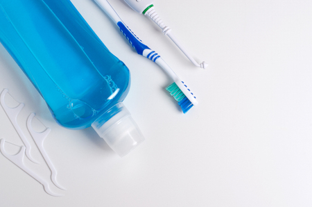 Dental hygiene. Toothbrush, mouthwash, dental floss, oral irrigator. Flat top viewの写真素材