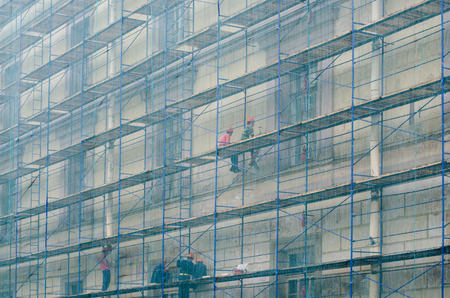 Workers on the multi-storey building