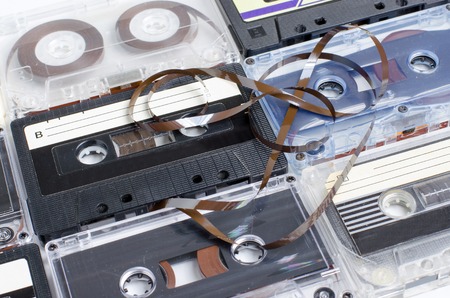 A lot of old audio cassettes. Side view. Close upの写真素材