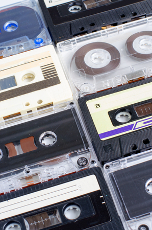 A lot of old audio cassettes. Vertical photoの写真素材