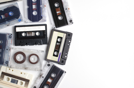 Old audio cassettes on white background. Flat top view. Space for textの写真素材